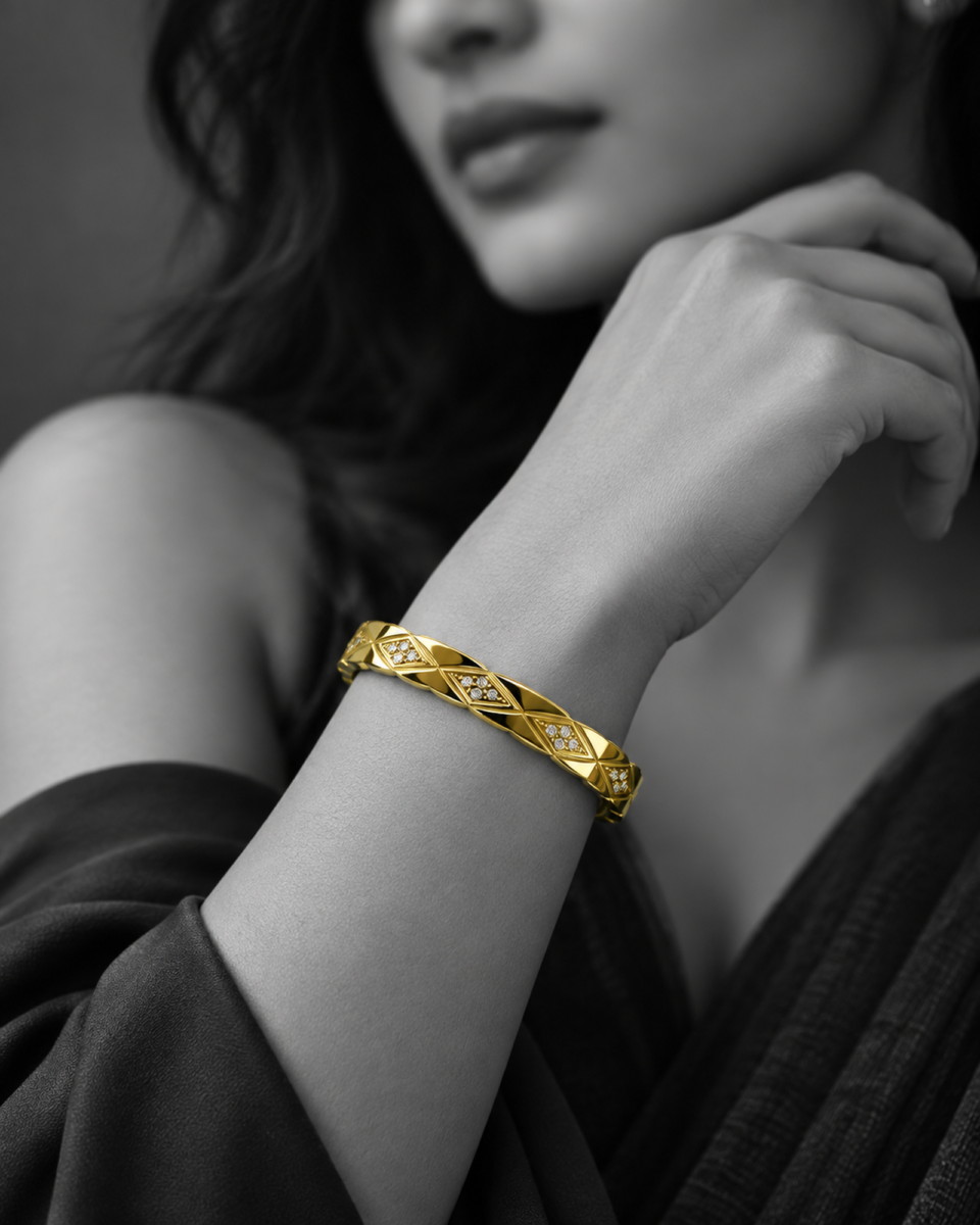 18K gold plated hinged bangle with a faceted quilted diamond pattern and three crystal clusters on a white background