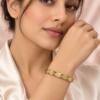 18K gold plated hinged bangle with a faceted quilted diamond pattern and three crystal clusters on a white background