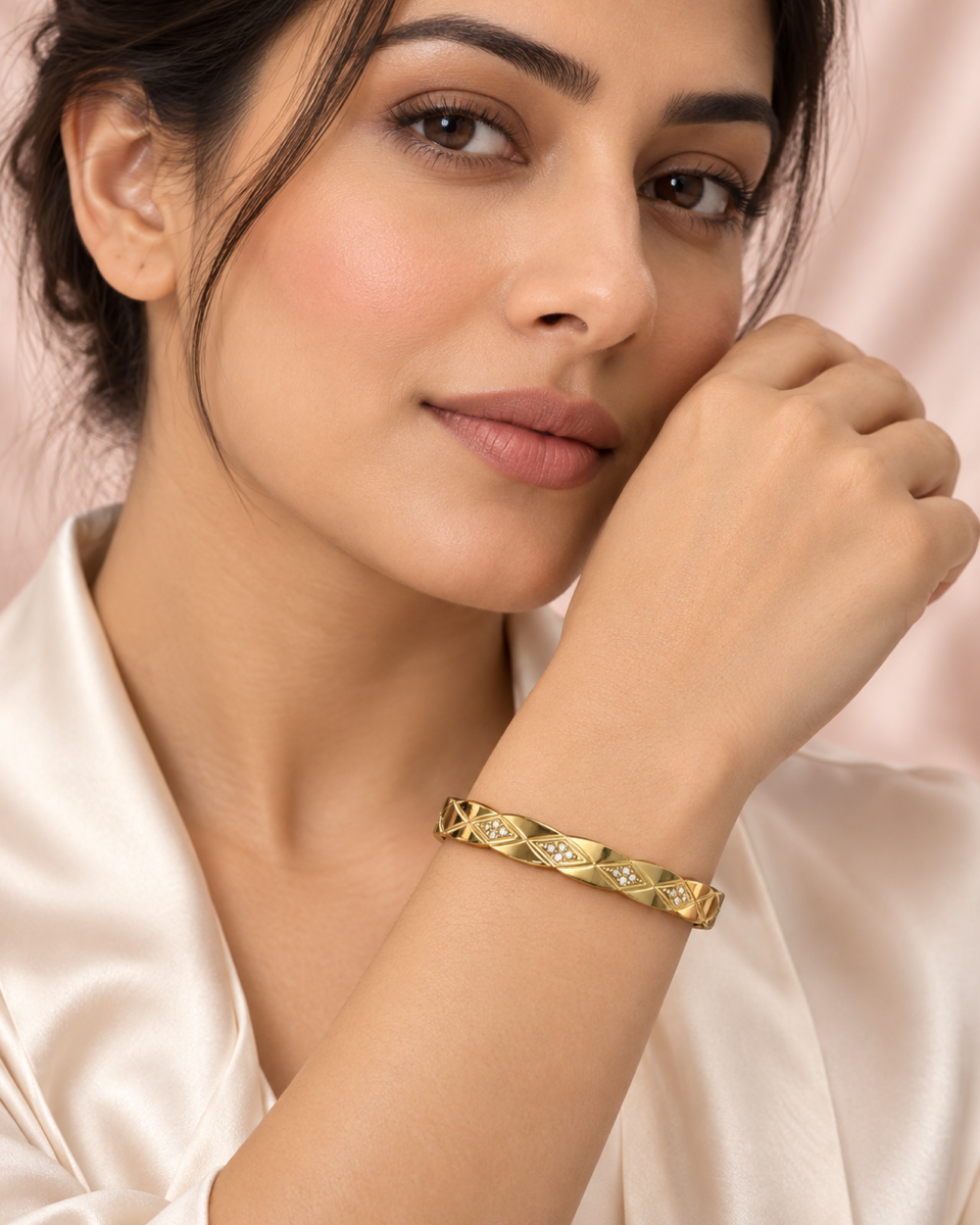 18K gold plated hinged bangle with a faceted quilted diamond pattern and three crystal clusters on a white background