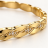 18K gold plated hinged bangle with a faceted quilted diamond pattern and three crystal clusters on a white background