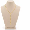 18K gold plated Y-shaped lariat necklace with polished bar stations on a fine curb chain and a three-bar drop, on a white background