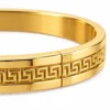 18K gold plated hinged bangle with a raised Greek key pattern around the band closure